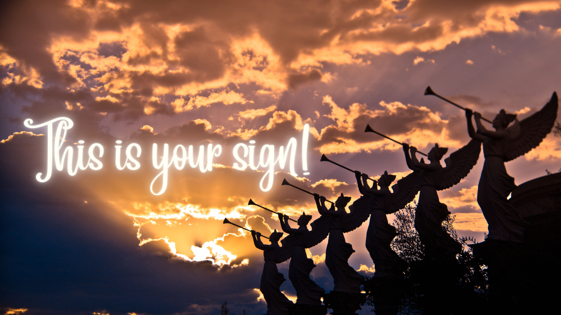 statues of angels with trumpets in shadow and in front of a spectacular break in the clouds with the light shining through. The words 'This is your sign' shine through